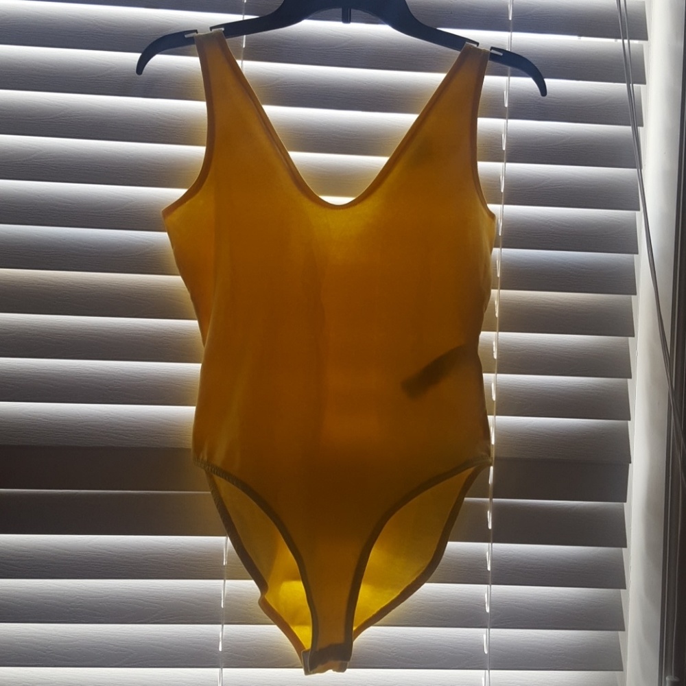 Yellow sleveleas body suit